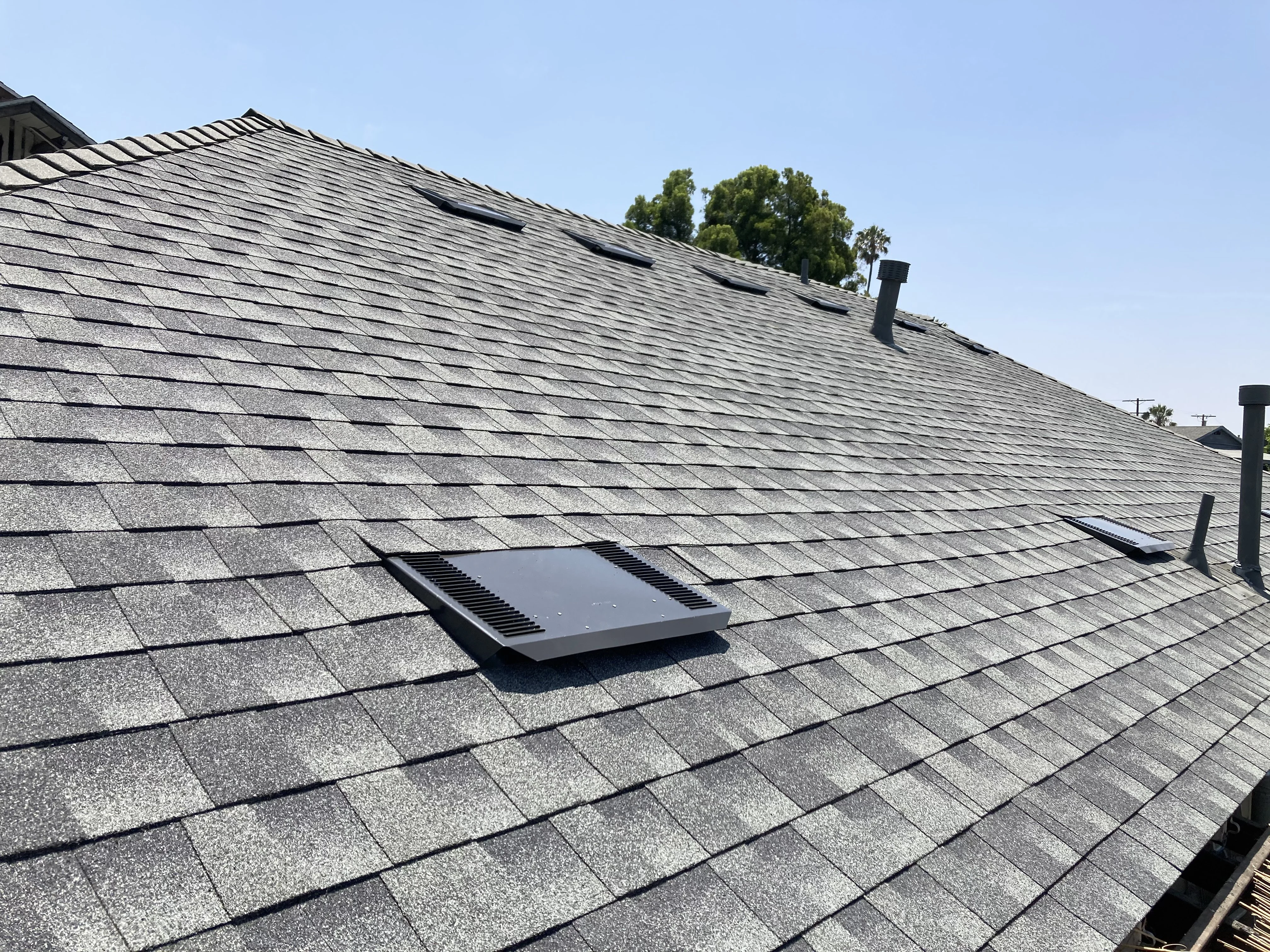 O'Hagin low-profile vents installed on an asphalt shingle roof