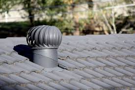 Turbine whirlybird vent installed on a tile roof